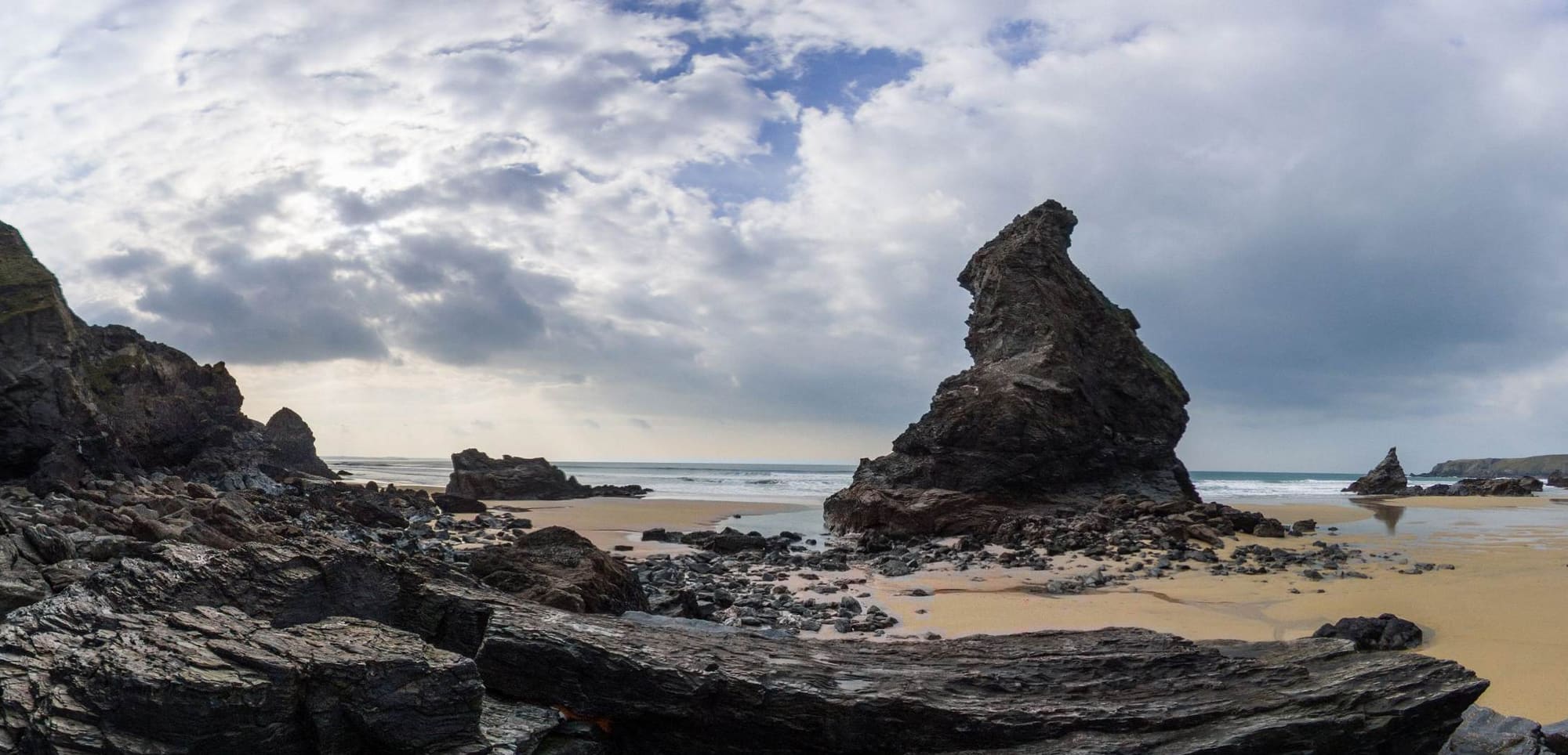 Rock formations standing apart on an empty beach
